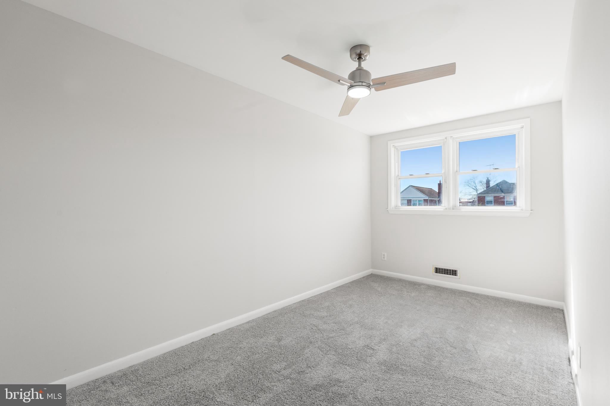 2727 Creston Road Baltimore, MD 21222 - Photo 14 of 30 a view of an empty room with a window