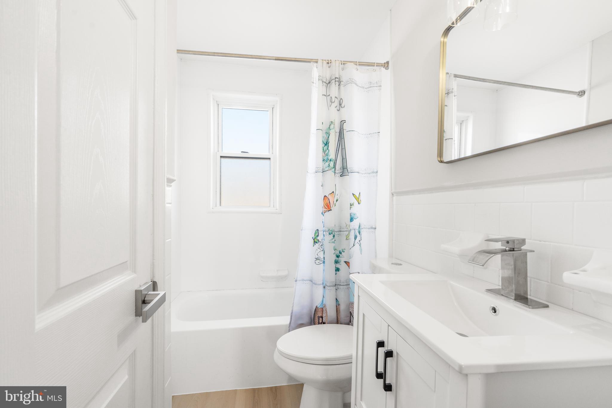 2727 Creston Road Baltimore, MD 21222 - Photo 19 of 30 a bathroom with a sink toilet and shower