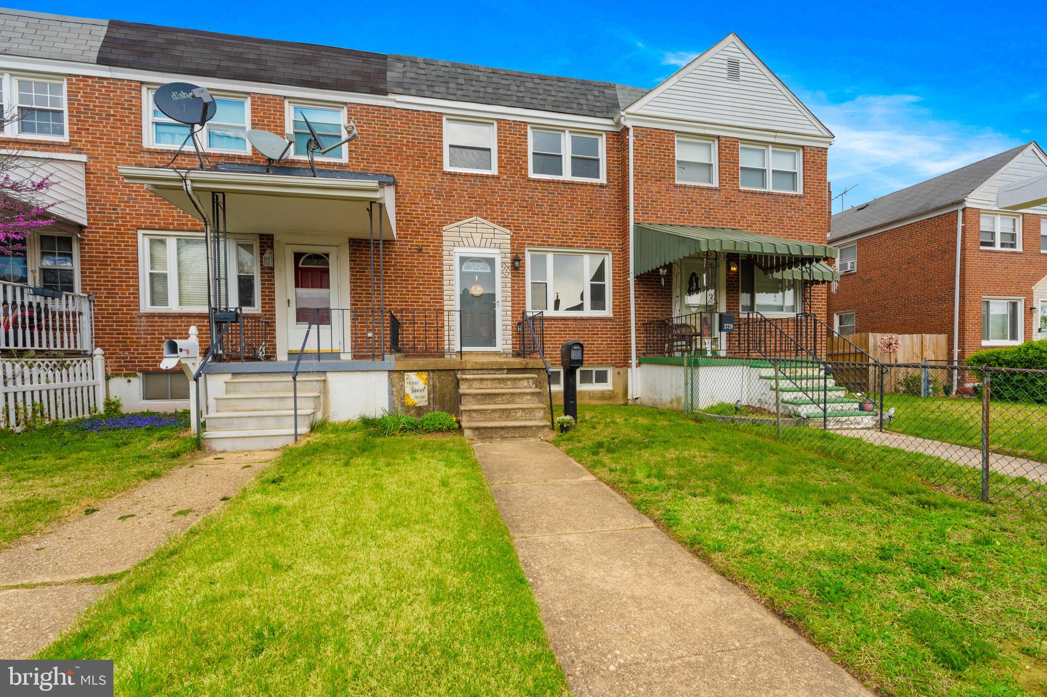 2727 Creston Road Baltimore, MD 21222 - Photo 2 of 30 a front view of a house with a yard