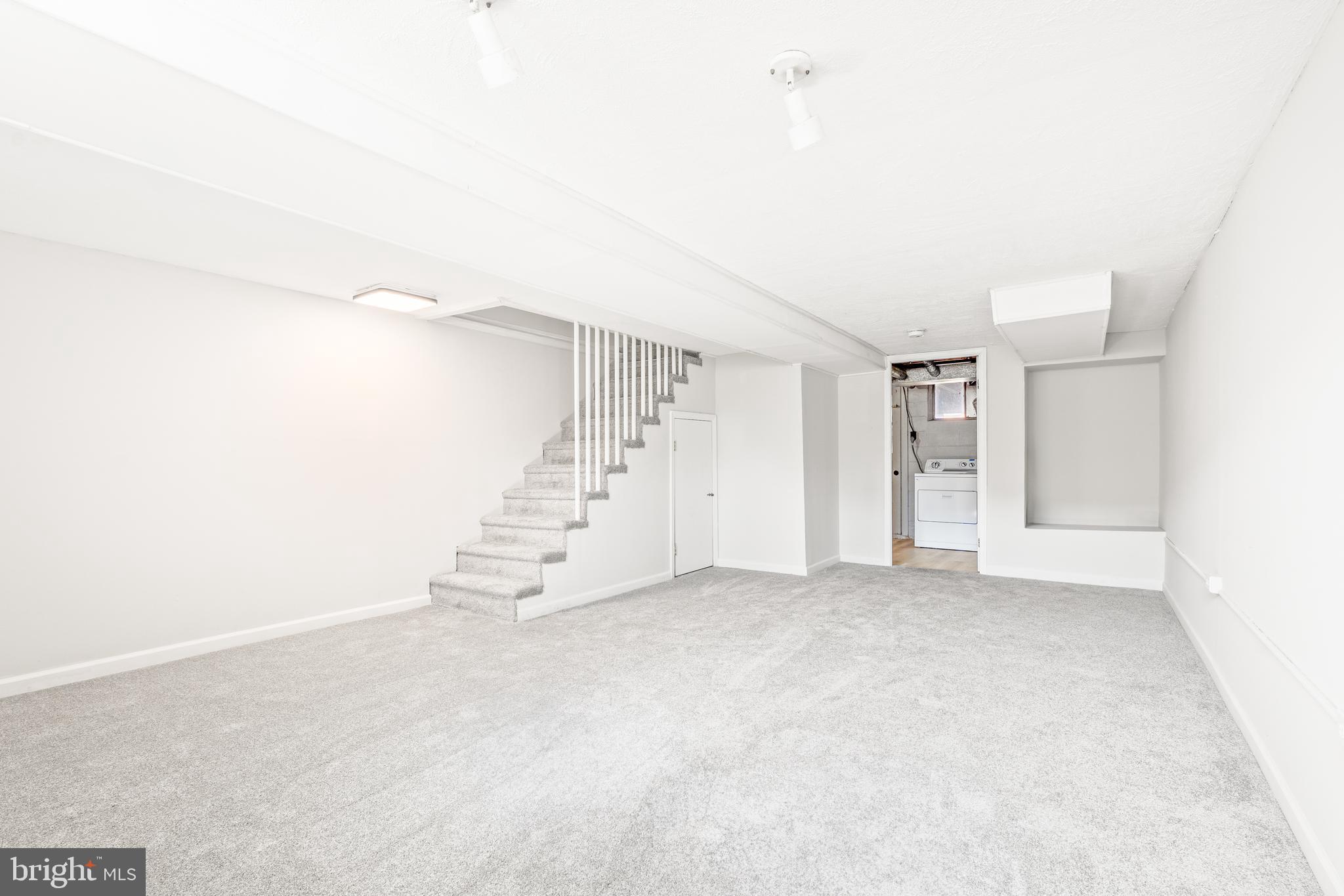 2727 Creston Road Baltimore, MD 21222 - Photo 21 of 30 an empty room with staircase and white walls