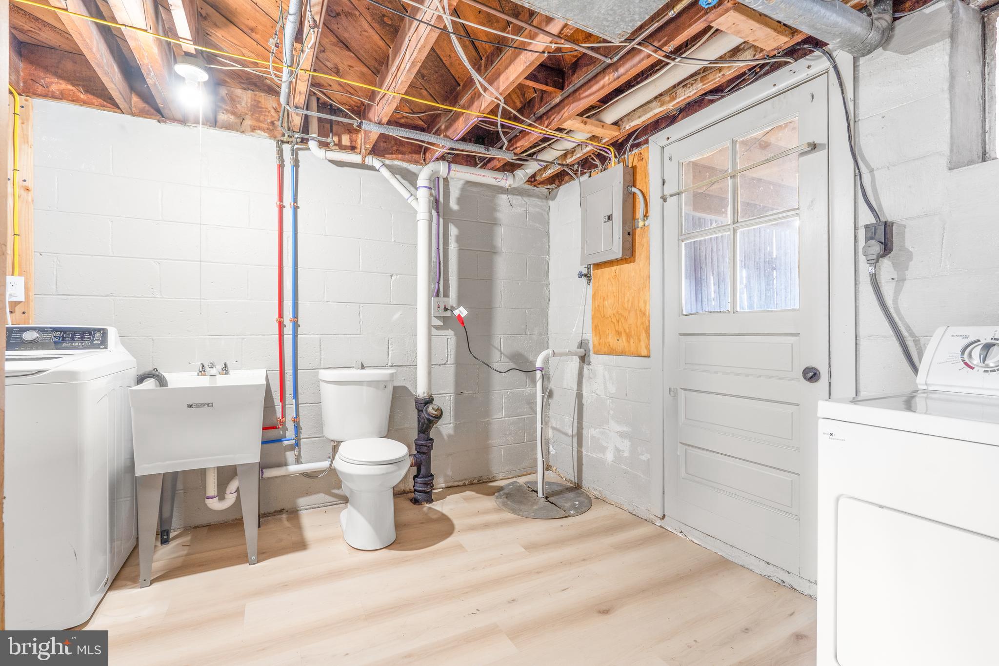 2727 Creston Road Baltimore, MD 21222 - Photo 23 of 30 a bathroom with a sink toilet and shower