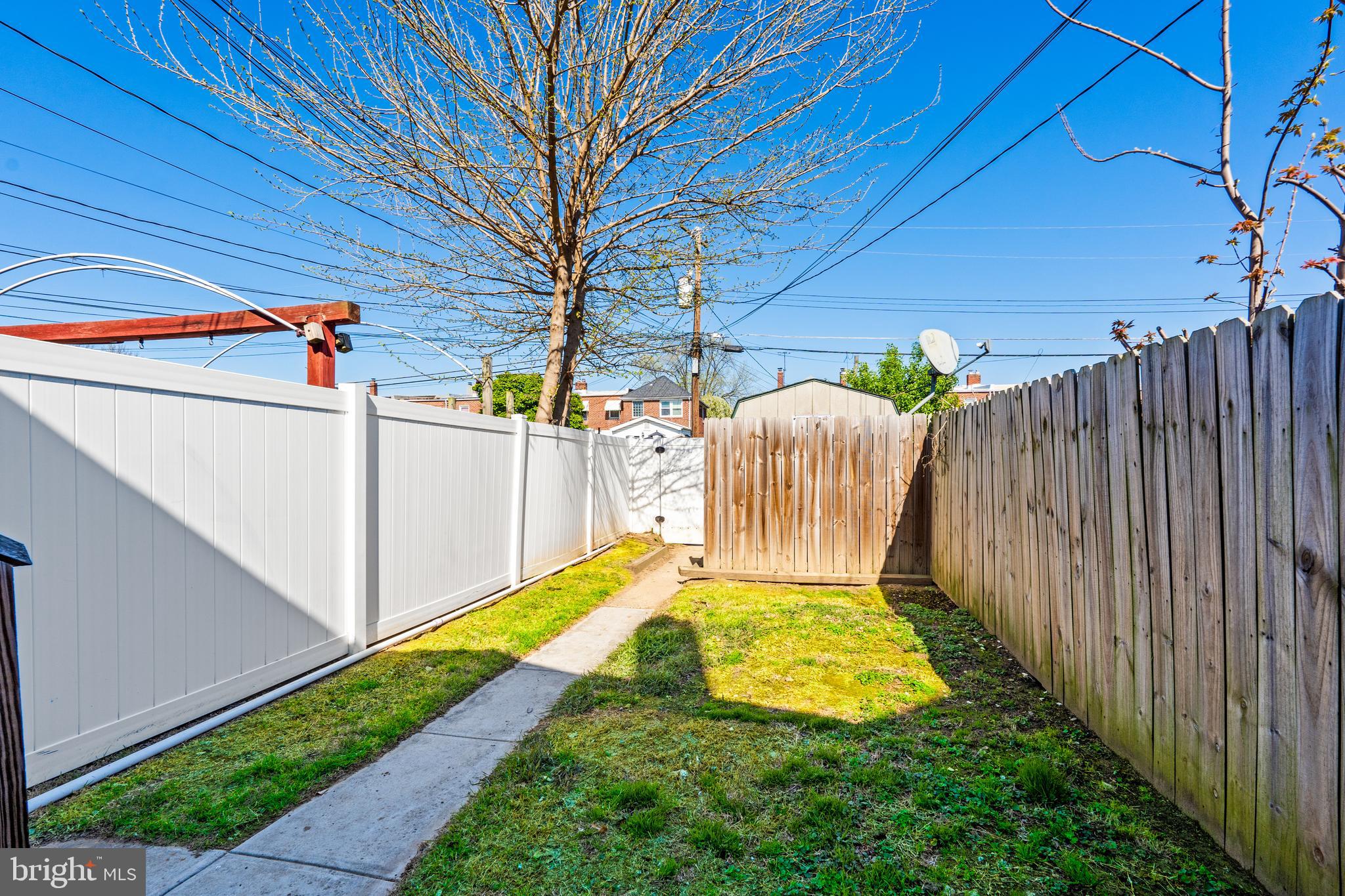 2727 Creston Road Baltimore, MD 21222 - Photo 24 of 30 a view of a backyard with wooden fence