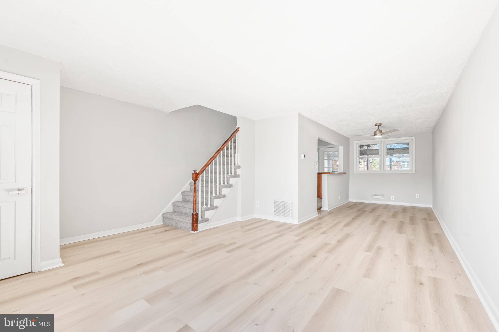 2727 Creston Road Baltimore, MD 21222 - Photo 3 of 30 a view of an empty room with stairs and a window