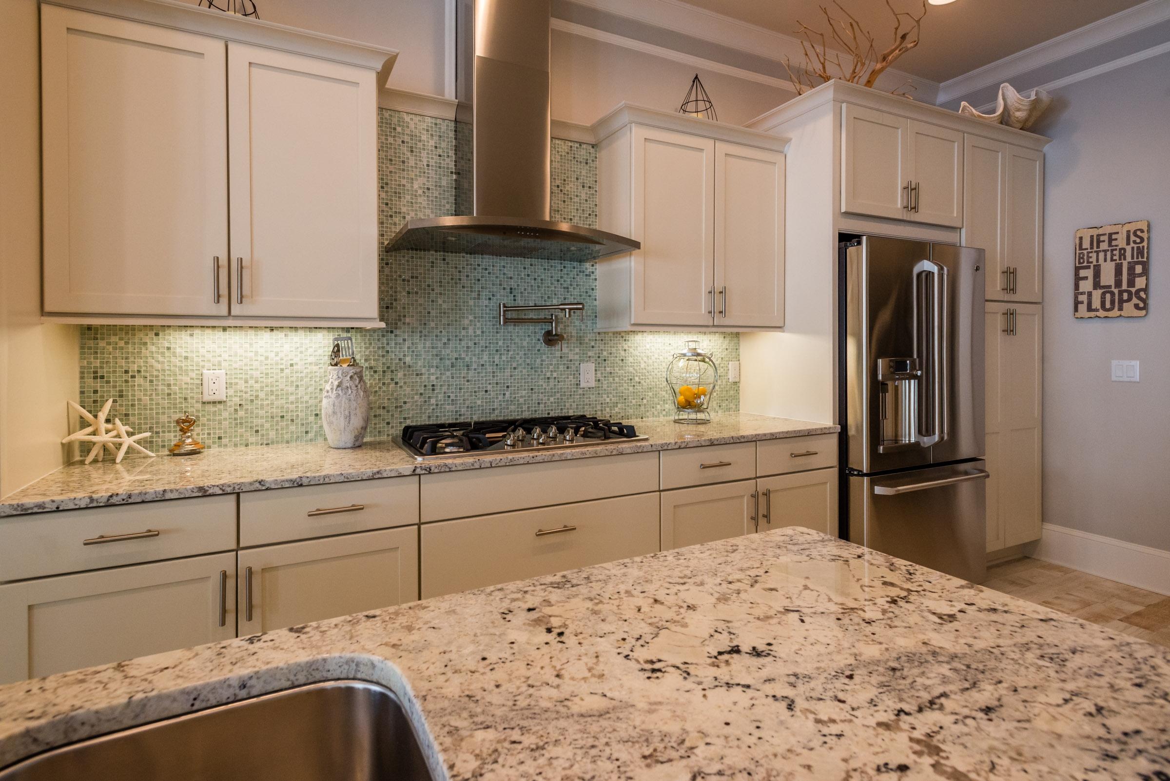35 Prominence Inlet Beach, Unit 35 Inlet Beach, FL 32461 - Photo 13 of 43 a kitchen with granite countertop a refrigerator sink and stove