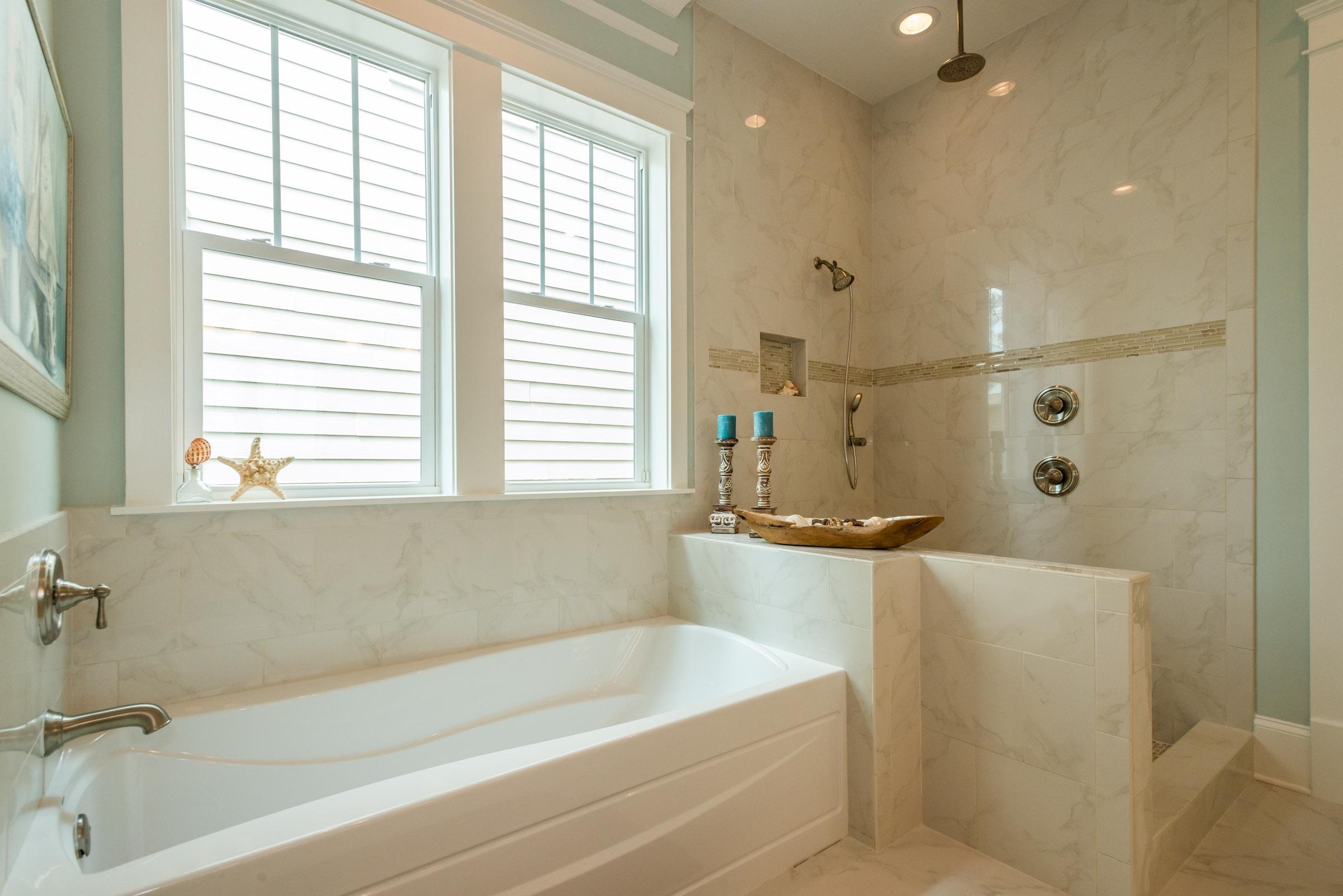 35 Prominence Inlet Beach, Unit 35 Inlet Beach, FL 32461 - Photo 26 of 43 a bathroom with a tub a sink and a window