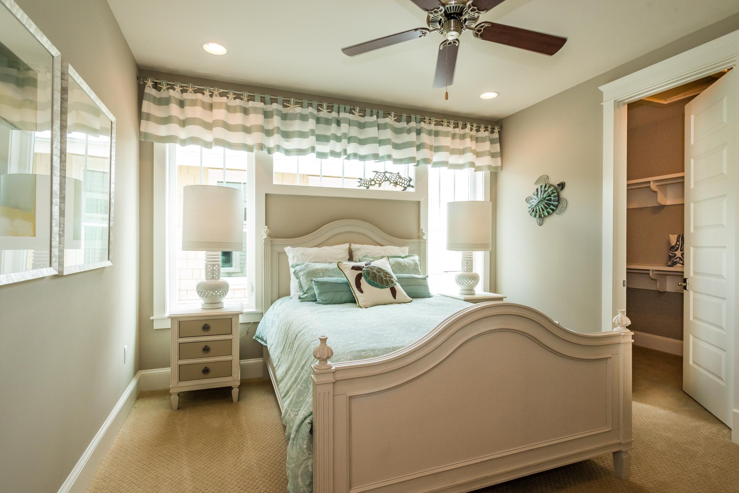 35 Prominence Inlet Beach, Unit 35 Inlet Beach, FL 32461 - Photo 37 of 43 a bedroom with a bed and a chandelier