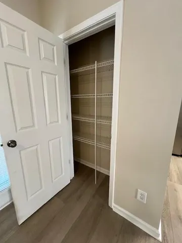 a view of an empty walk in closet