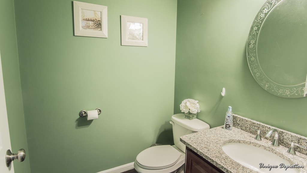 41 Boston Road, Unit 451 Billerica, MA 01862 - Photo 11 of 20 a bathroom with a granite countertop toilet sink and mirror