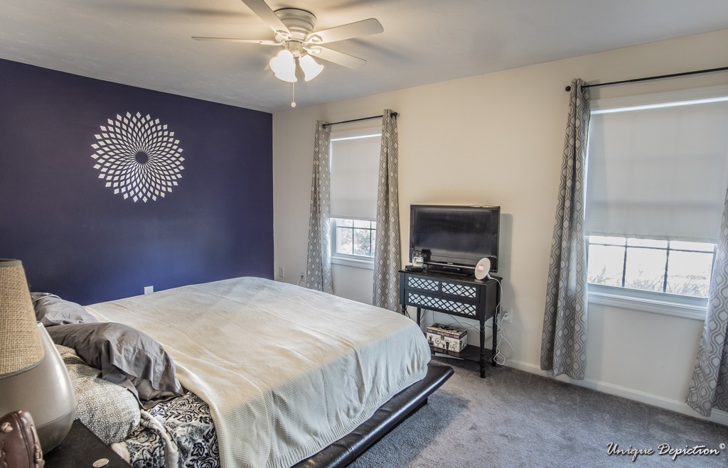 41 Boston Road, Unit 451 Billerica, MA 01862 - Photo 12 of 20 a bedroom with a bed and a flat screen tv