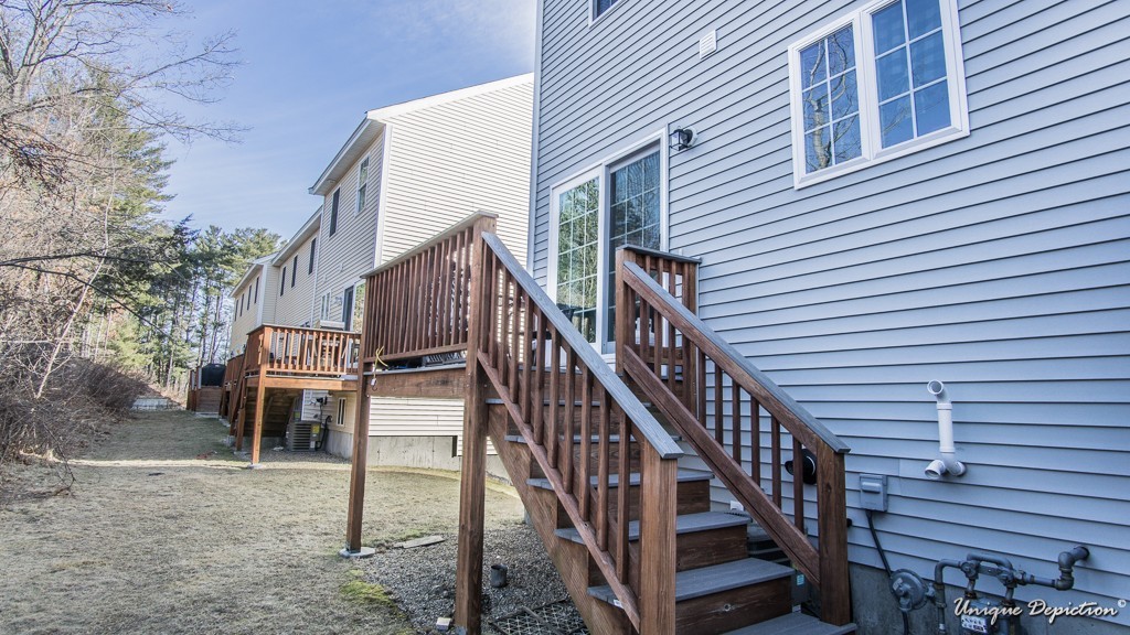 41 Boston Road, Unit 451 Billerica, MA 01862 - Photo 20 of 20 a view of a house with wooden stairs