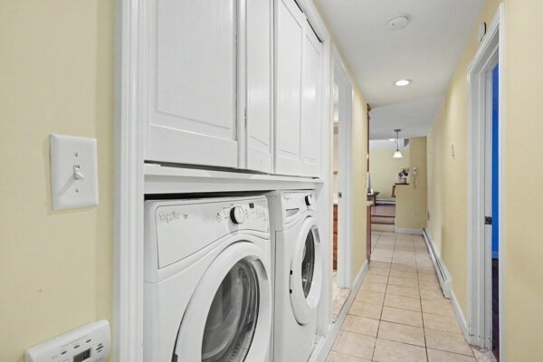 59 Donald Road Burlington, MA 01803 - Photo 7 of 12 a view of a hallway with washer and dryer