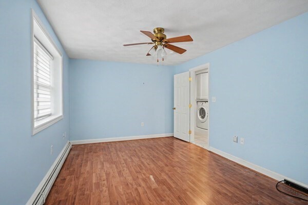 59 Donald Road Burlington, MA 01803 - Photo 8 of 12 wooden floor in an empty room with a window