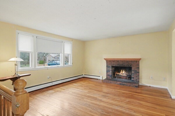 59 Donald Road Burlington, MA 01803 - Photo 9 of 12 an empty room with windows and fireplace