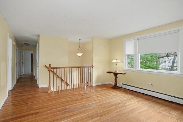 59 Donald Road Burlington, MA 01803 - Photo 10 of 12 a view of a livingroom with wooden floor and a window