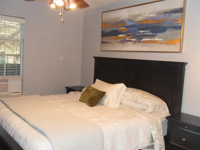 a view of a wooden bench in the backyard