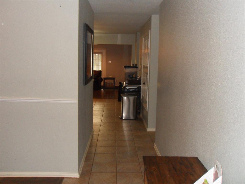 2607 Trinity Terrace Corinth, TX 76210 - Photo 7 of 21 Hallway leading to kitchen and great room