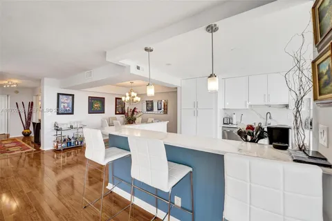 a spacious bathroom with a shower sink mirror and toilet