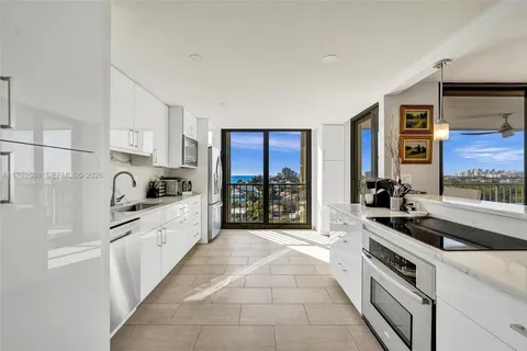 a bathroom with a sink a mirror and a shower