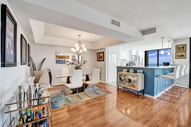 a kitchen with stainless steel appliances granite countertop a stove and a sink