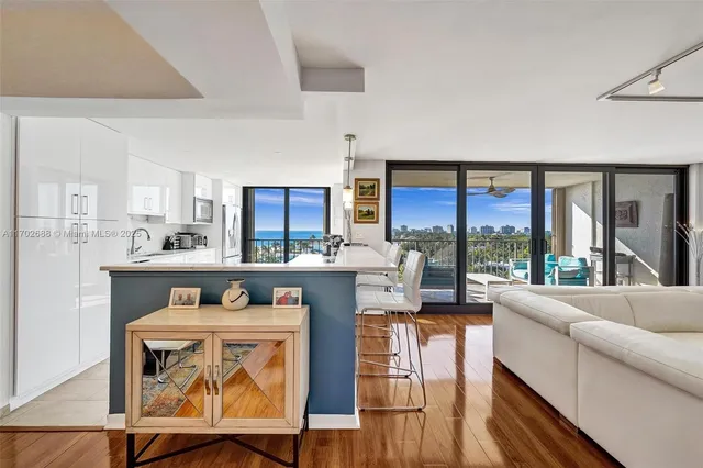 a kitchen with granite countertop a sink and cabinets