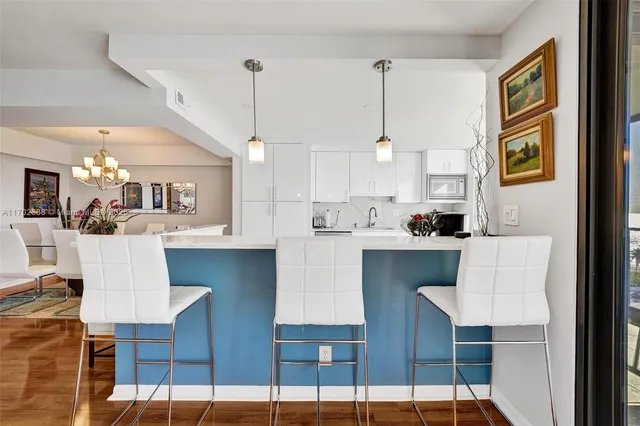 a kitchen with stainless steel appliances granite countertop a stove and a refrigerator