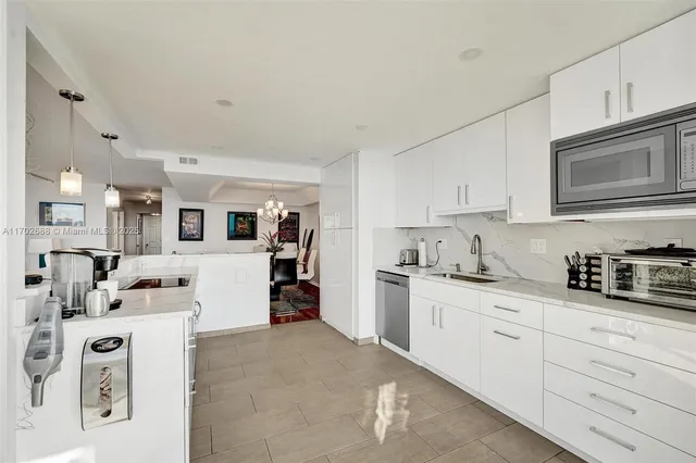 a kitchen with a washer and dryer