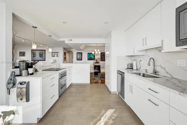 a view of a livingroom with furniture and a window