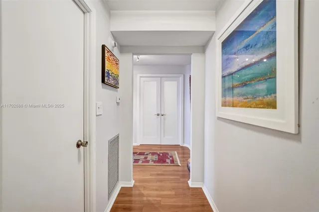 a living room with furniture workspace and a flat screen tv