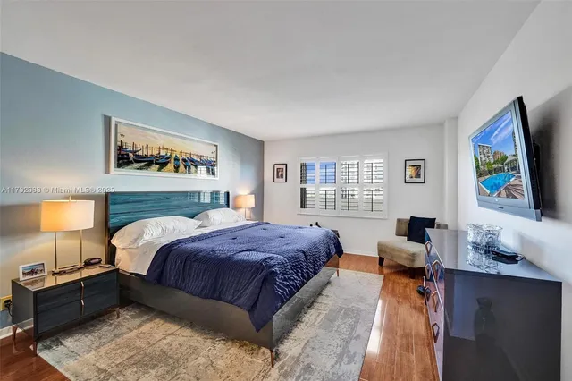 a living room with fireplace furniture and a flat screen tv