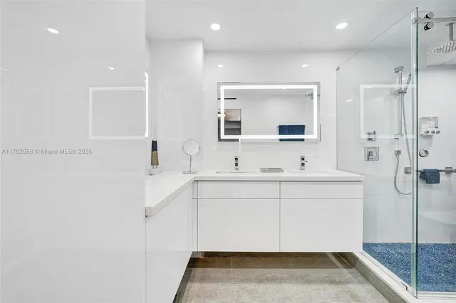 an aerial view of a residential houses with city view