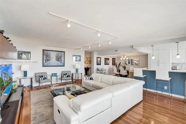 a living room with furniture fireplace and a flat screen tv