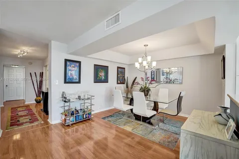 a kitchen with granite countertop a sink and cabinets