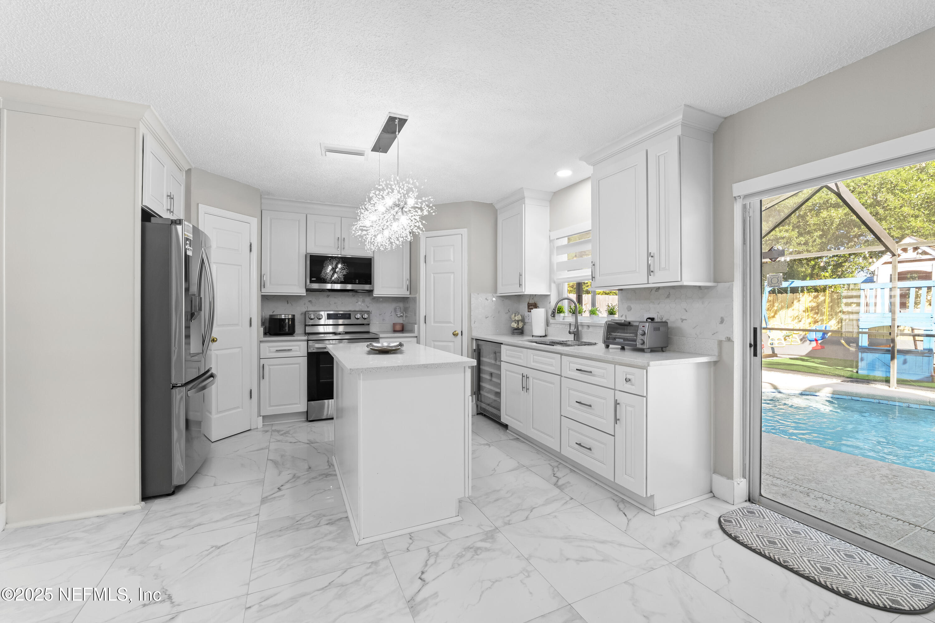 3447 Caroline Ridge Lane East Jacksonville, FL 32225 - Photo 14 of 44 a kitchen with sink cabinets and refrigerator