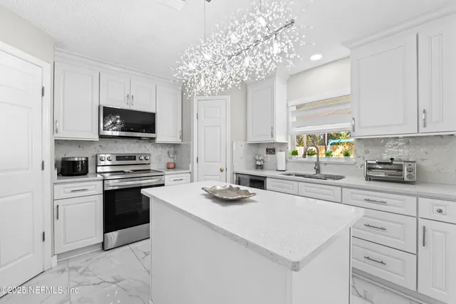 a kitchen with furniture and window