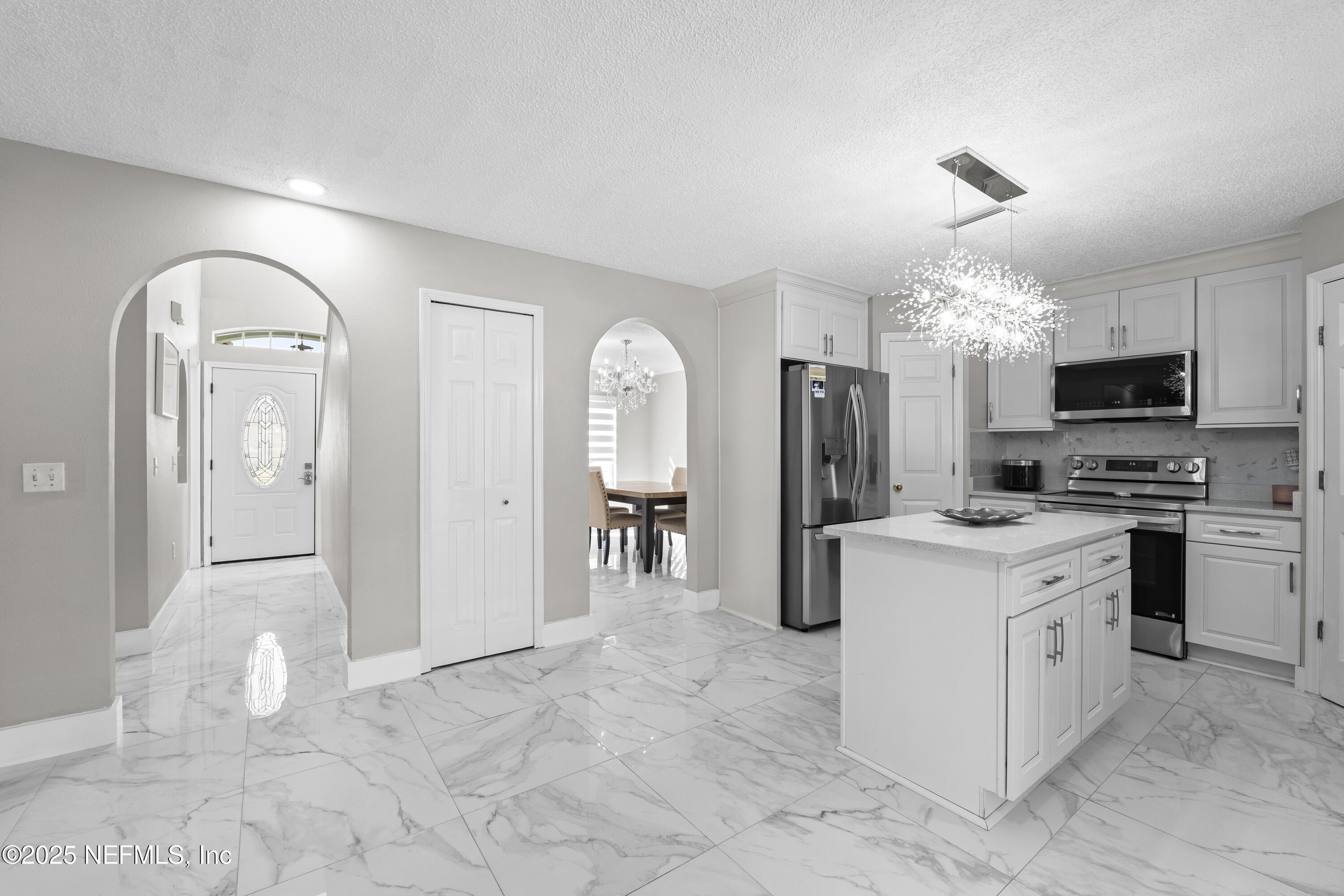 3447 Caroline Ridge Lane East Jacksonville, FL 32225 - Photo 20 of 44 a view of a kitchen with refrigerator and microwave