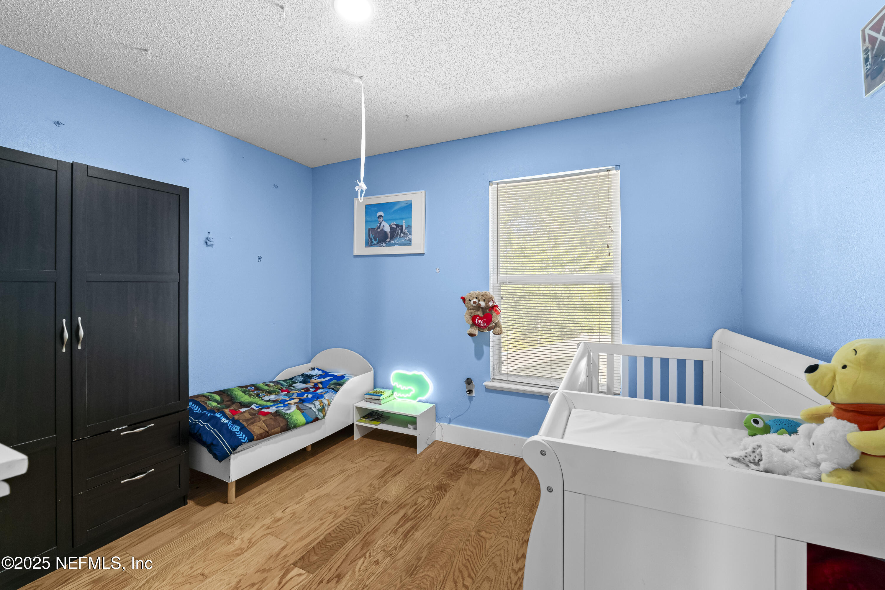 3447 Caroline Ridge Lane East Jacksonville, FL 32225 - Photo 22 of 44 a bedroom with a bed and a table in it