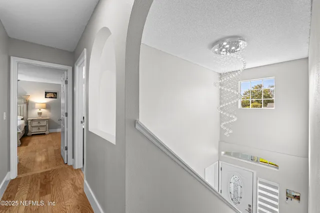 a bathroom with a sink a toilet a mirror and shower curtain