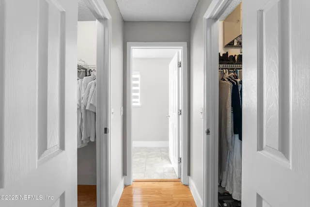 a bathroom with a sink a mirror and a shower