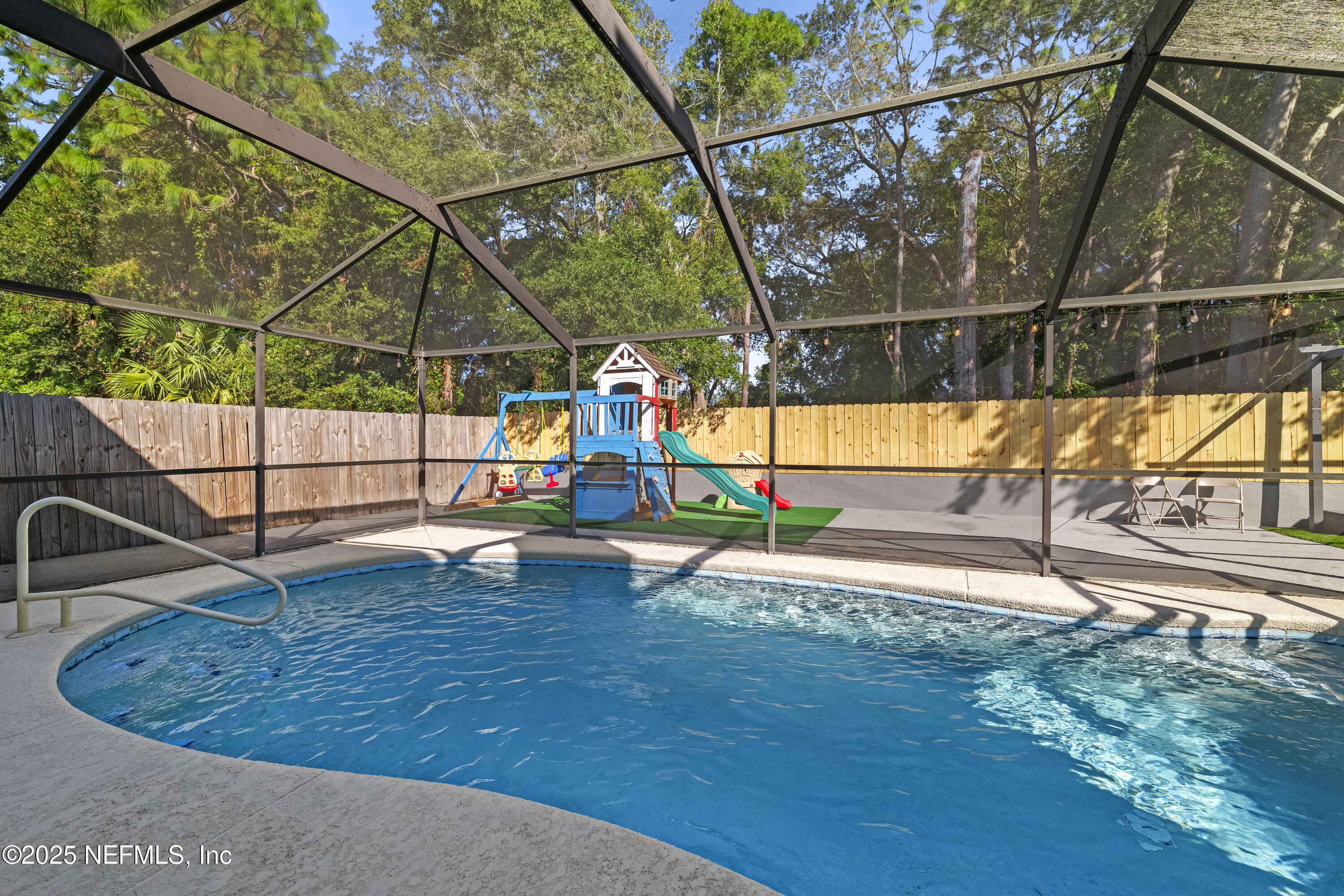 3447 Caroline Ridge Lane East Jacksonville, FL 32225 - Photo 34 of 44 a view of outdoor space with a swimming pool