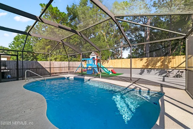 a view of yard with patio