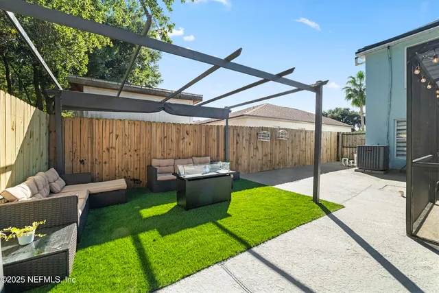 a view of a garage with a bike and wooden roof