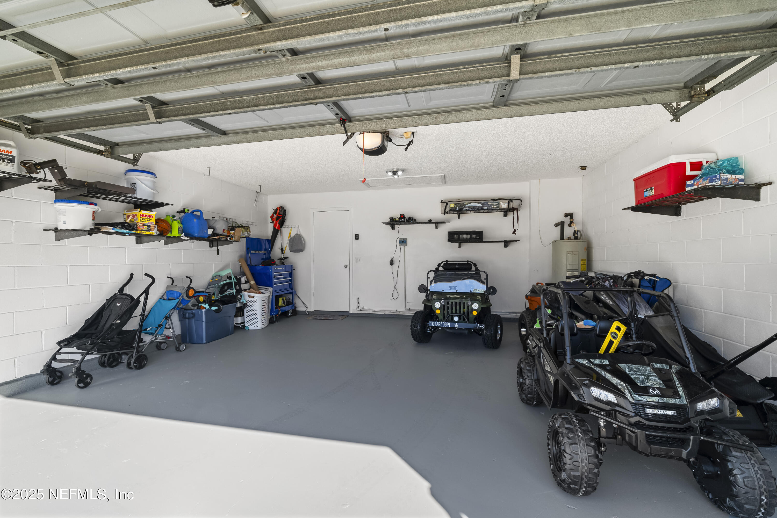 3447 Caroline Ridge Lane East Jacksonville, FL 32225 - Photo 41 of 44 a view of a garage with a bike and wooden roof