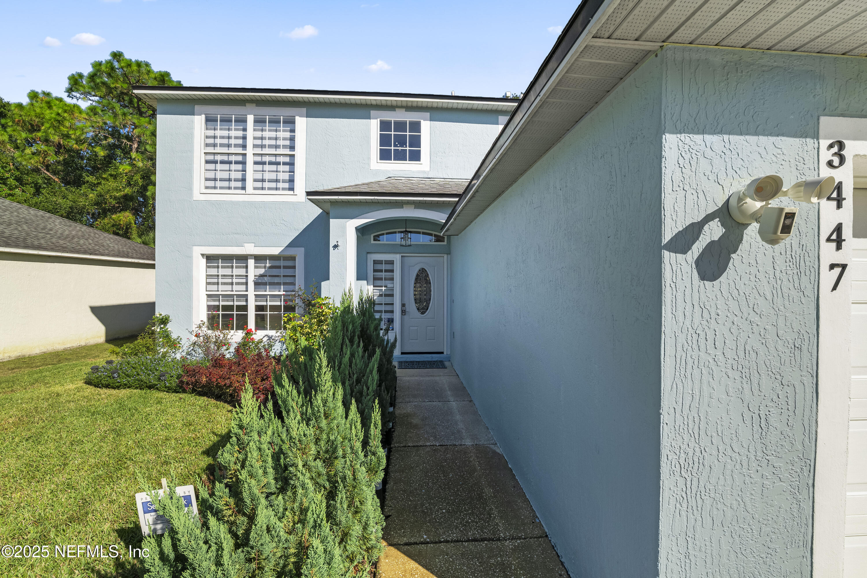3447 Caroline Ridge Lane East Jacksonville, FL 32225 - Photo 44 of 44 a front view of a house with garden