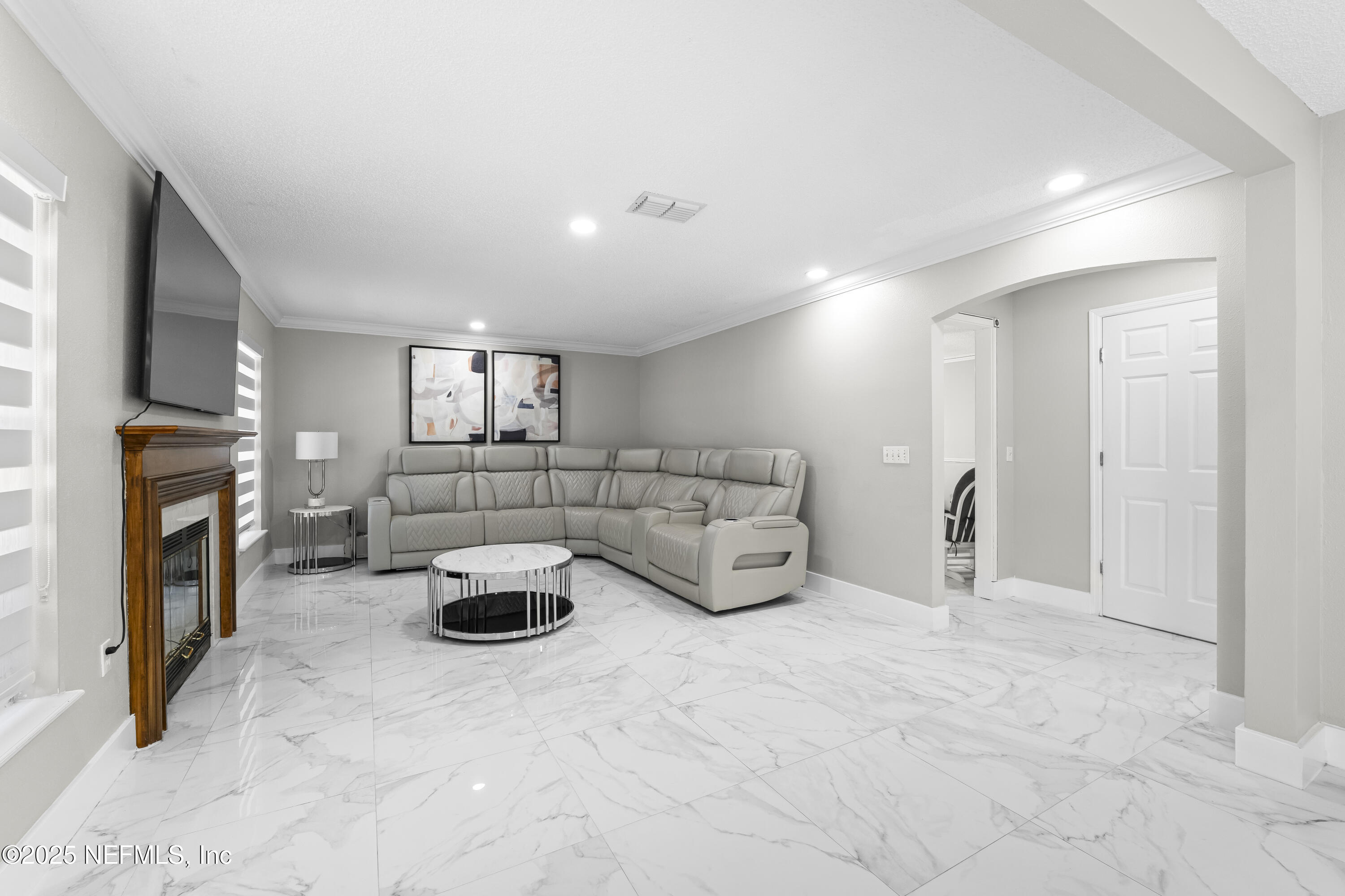 3447 Caroline Ridge Lane East Jacksonville, FL 32225 - Photo 7 of 44 a living room with furniture and a fireplace