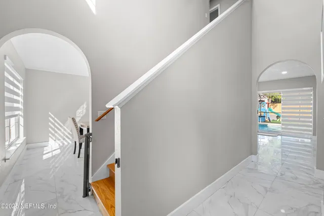 a utility room with dryer and sink