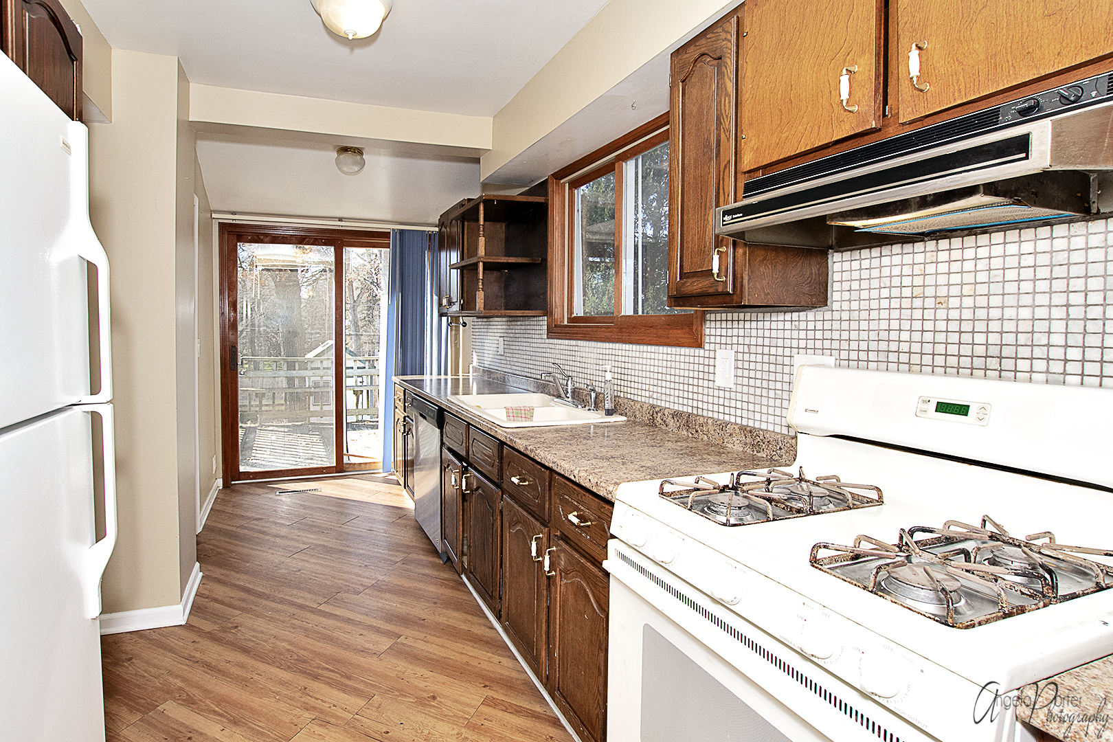 28537 West Treetop Road Ingleside, IL 60041 - Photo 2 of 29 a kitchen with a sink stove and cabinets