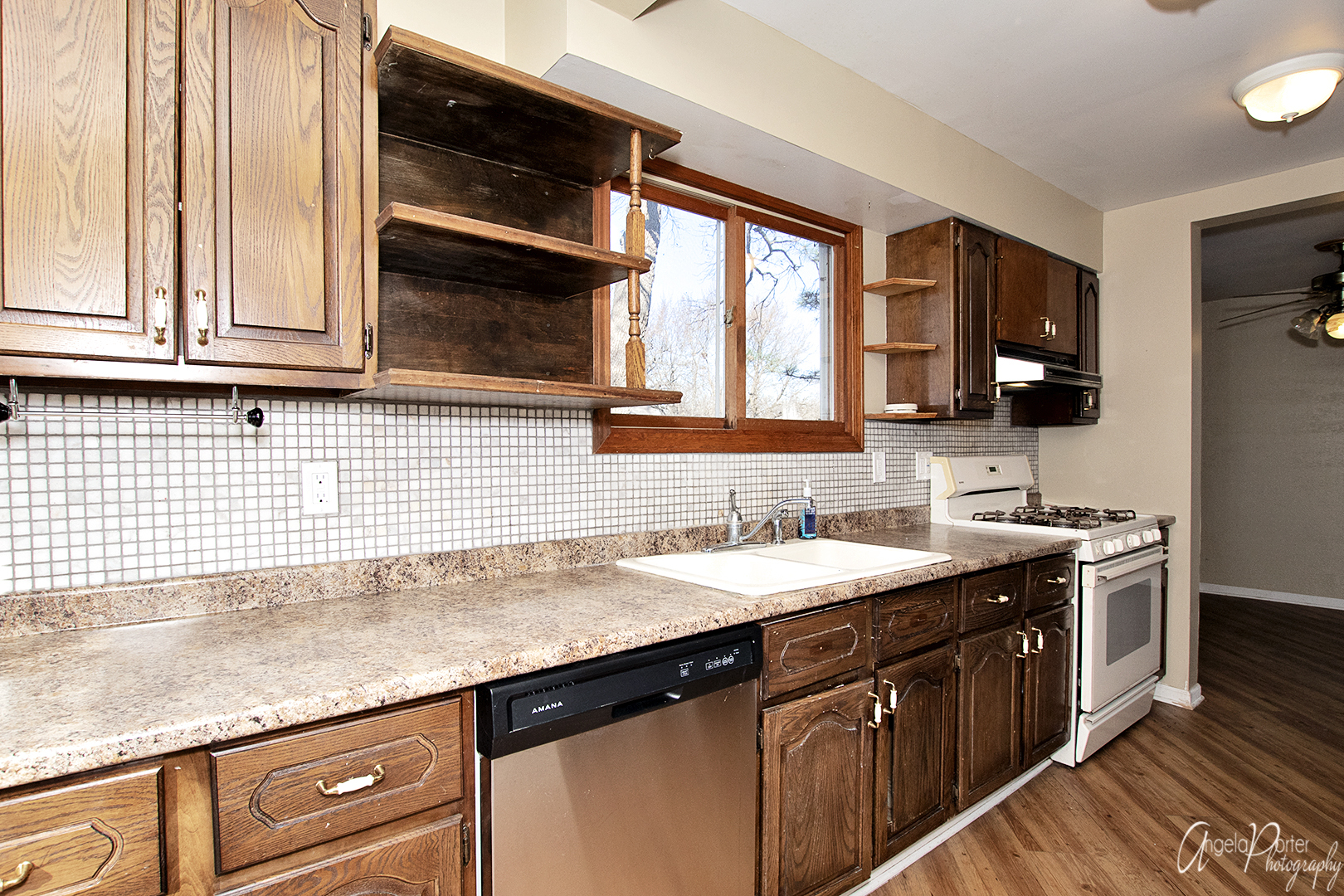 28537 West Treetop Road Ingleside, IL 60041 - Photo 4 of 29 a kitchen with granite countertop a sink stove and cabinets
