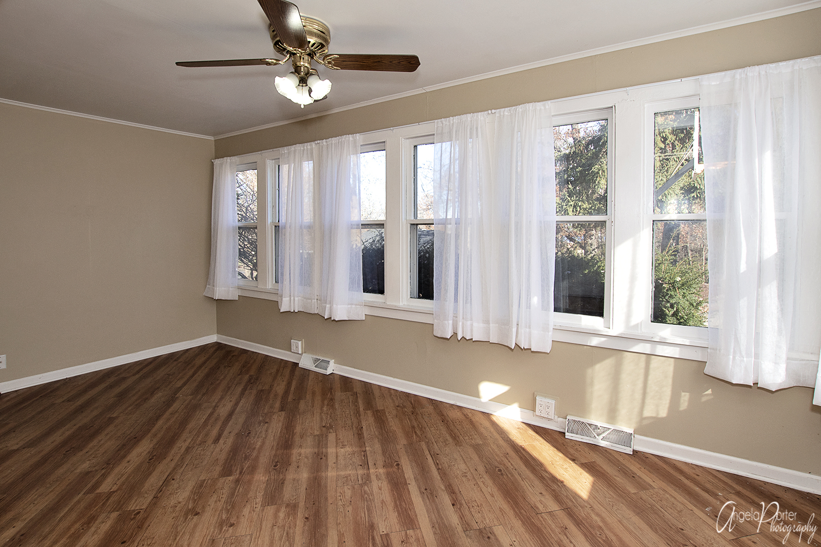 28537 West Treetop Road Ingleside, IL 60041 - Photo 5 of 29 a view of an empty room with wooden floor and a window