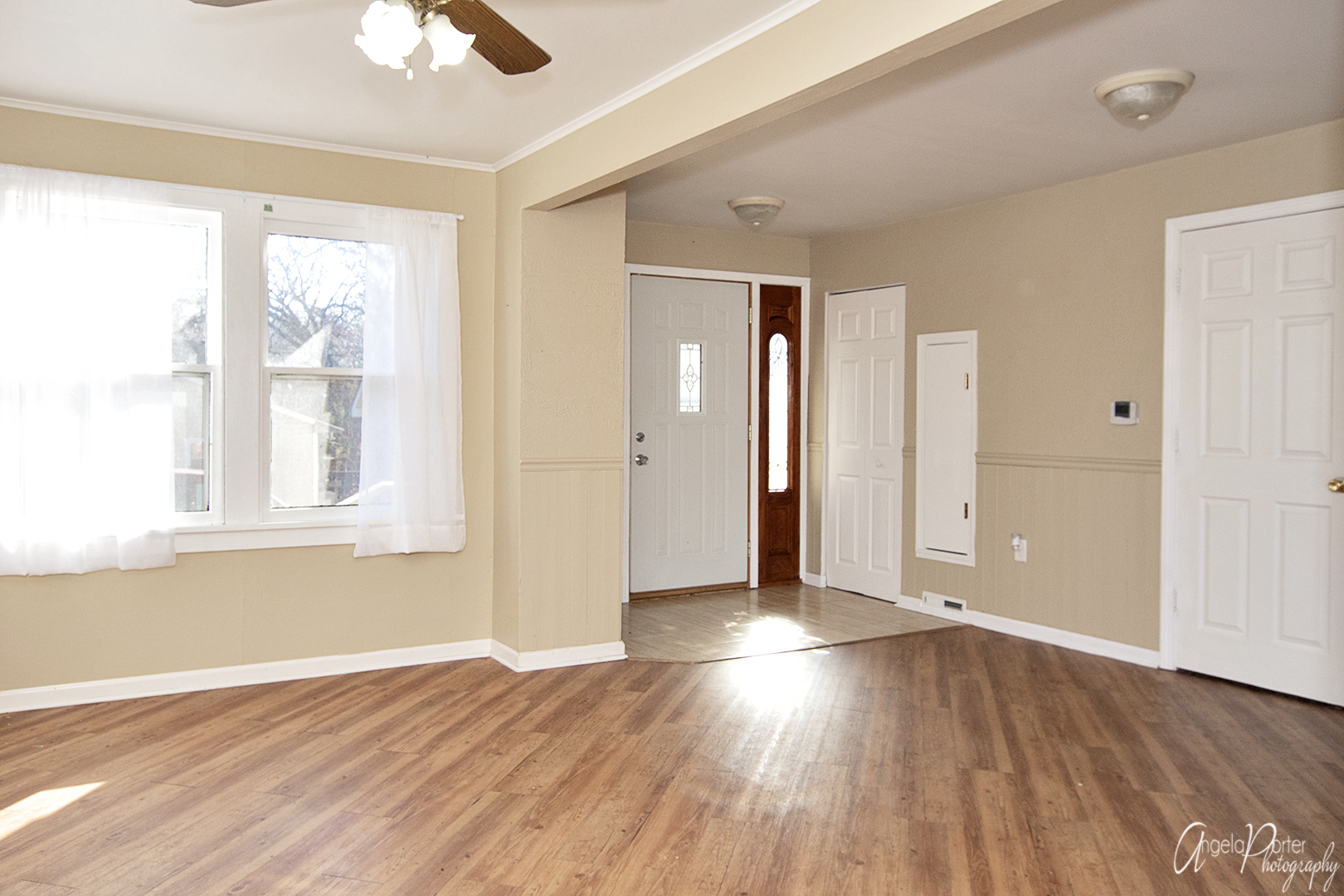 28537 West Treetop Road Ingleside, IL 60041 - Photo 7 of 29 an empty room with wooden floor and windows