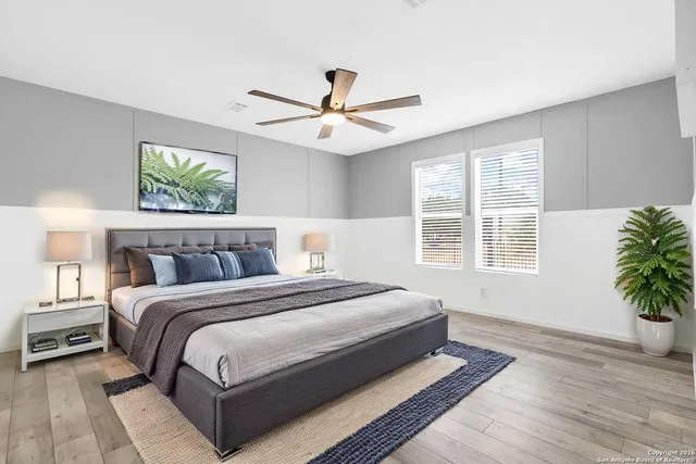 a spacious bedroom with a large bed and a window